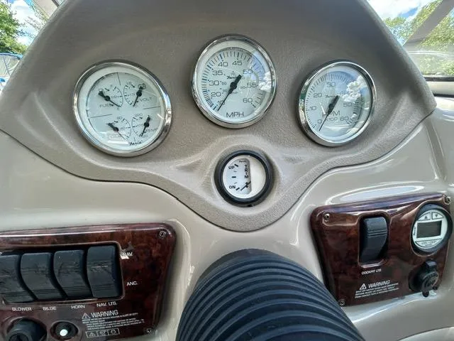 Slide: The Image of 2005 Four Winns 190 Horizon LE dashboard with gauges and controls. - 23