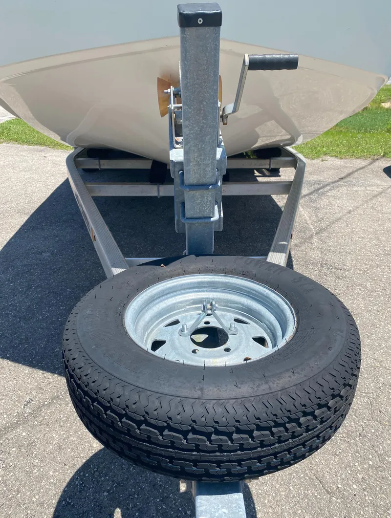 Slide: The Image of 2017 Sundance DX 22 boat trailer with spare tire. - 12