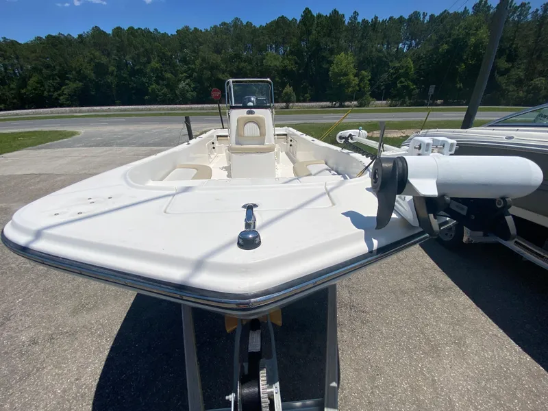 Slide: The Image of 2017 Sundance DX 22 boat on trailer in outdoor setting. - 5