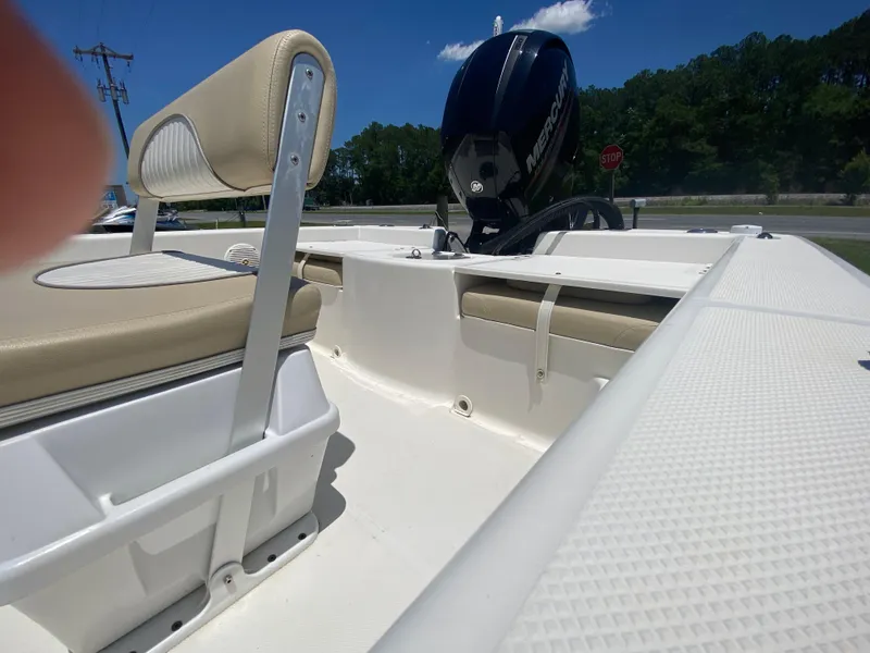 Slide: The Image of 2017 Sundance DX 22 boat interior with Mercury outboard motor. - 6