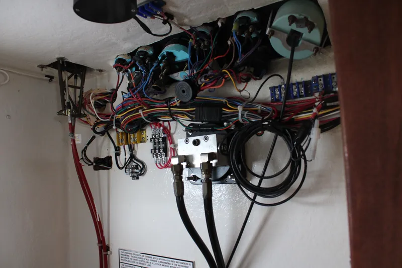 Slide: The Image of Electrical wiring and components inside a 1996 Webbers Cove 26 boat. - 25
