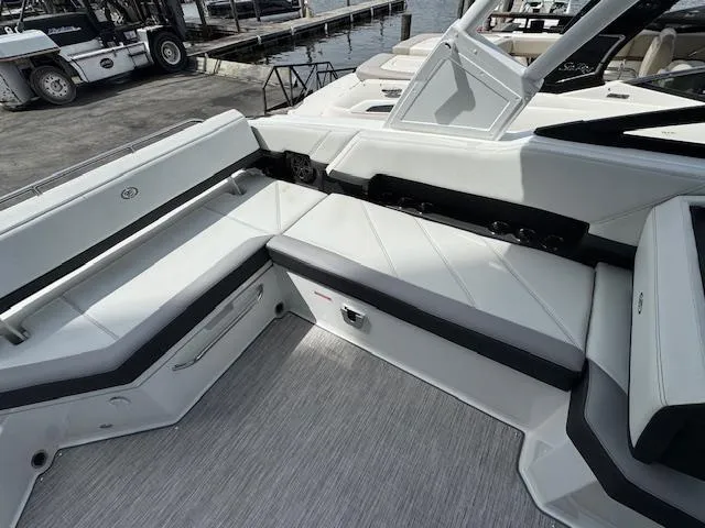 Slide: The Image of 2024 Cobalt R8 boat interior with sleek white seating and modern design. - 13