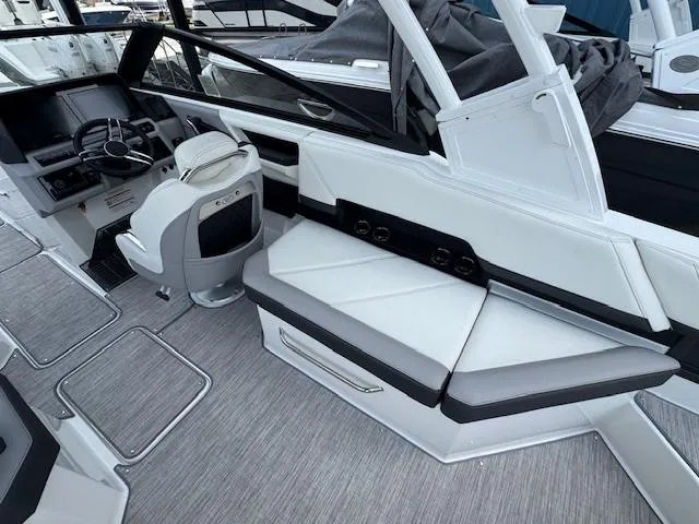 Slide: The Image of 2024 Cobalt R8 boat interior with sleek seating and modern dashboard design. - 14