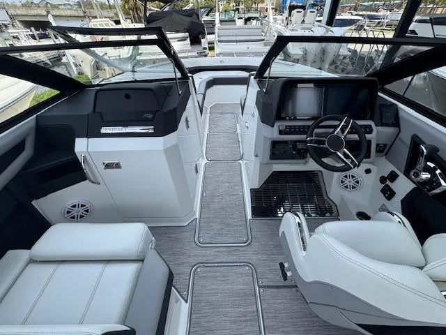 Slide: The Image of 2024 Cobalt R8 boat interior with modern dashboard, steering wheel, and luxurious seating. - 15