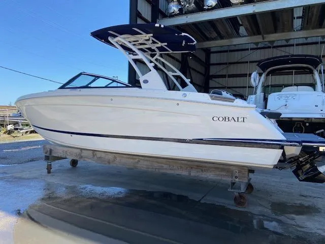 Slide: The Image of 2024 Cobalt R8 boat in storage, side view. - 7