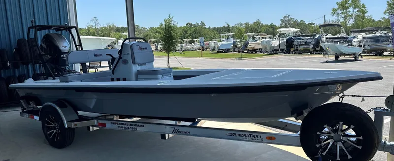 The Image of 2024 Maverick 18 HPX-V boat on a trailer in a marina. - 0