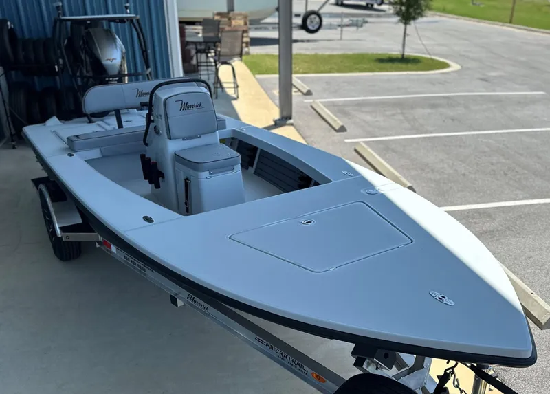 Slide: The Image of 2024 Maverick 18 HPX-V boat on trailer in parking lot. - 1