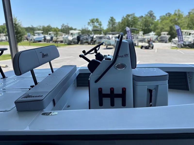 Slide: The Image of 2024 Maverick 18 HPX-V boat interior with steering console and seating. - 10
