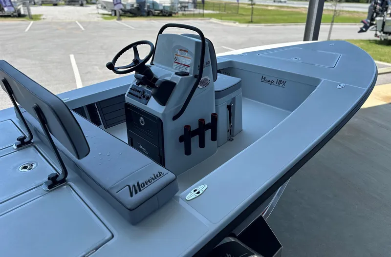 Slide: The Image of 2024 Maverick 18 HPX-V boat interior with steering console and storage compartments. - 11