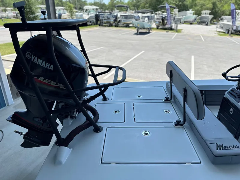 Slide: The Image of 2024 Maverick 18 HPX-V boat with Yamaha outboard motor in a marina. - 12