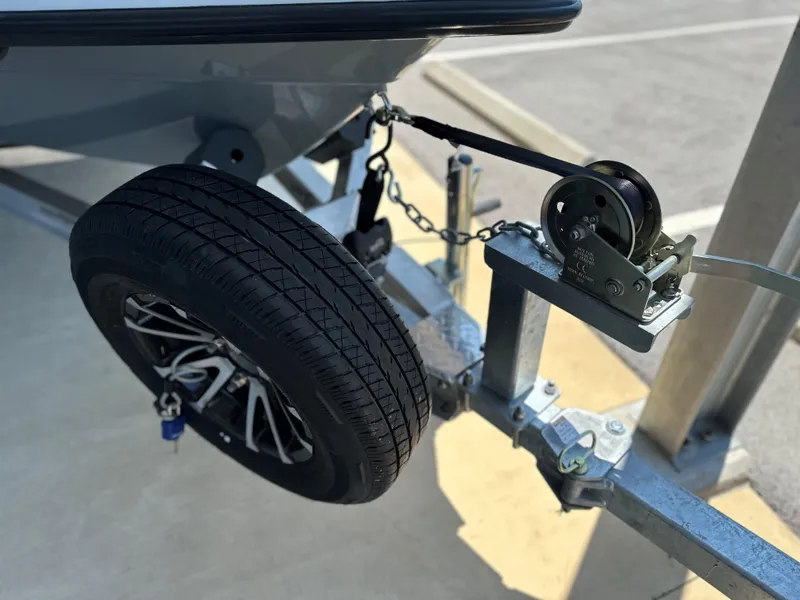 Slide: The Image of 2024 Maverick 18 HPX-V boat trailer with spare tire and winch. - 17