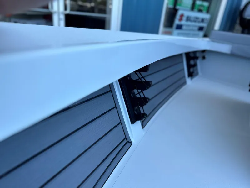 Slide: The Image of 2024 Maverick 18 HPX-V boat interior detail with rod holders. - 6