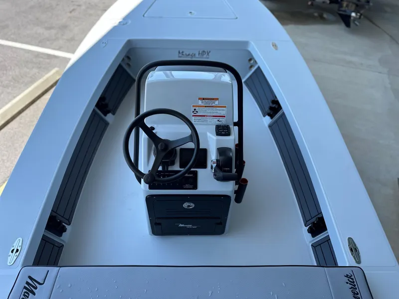 Slide: The Image of 2024 Maverick 18 HPX-V center console boat interior with steering wheel and controls. - 8
