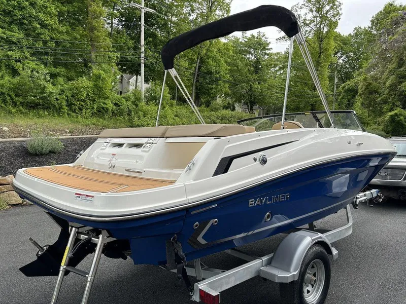 Slide: The Image of 2024 Bayliner VR5 Bowrider boat on trailer, rear view, outdoors. - 5