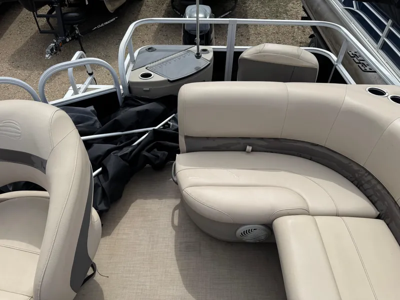 Slide: The Image of 2020 Sun Tracker Bass Buggy 18 DLX pontoon boat interior with beige seating. - 20