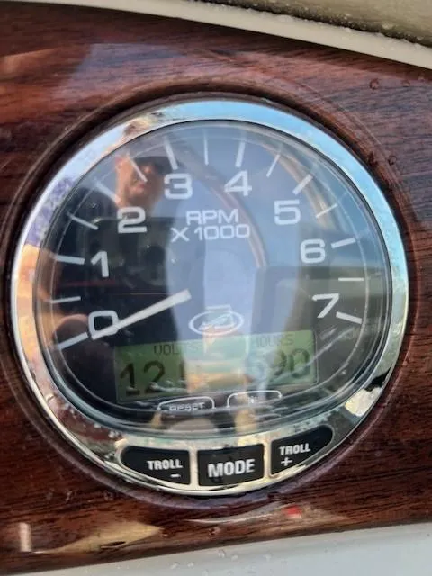 Slide: The Image of Close-up of 2005 Sea Ray 240 Sundeck RPM gauge on wooden dashboard. - 6