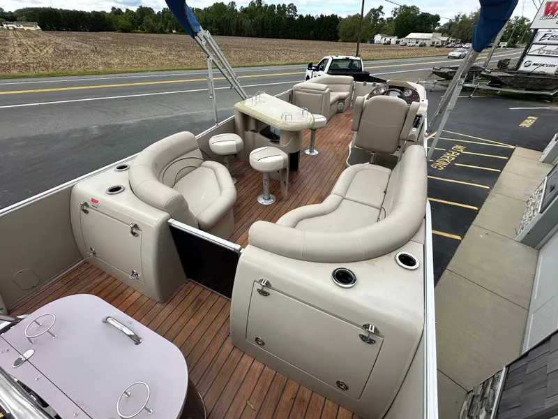 Slide: The Image of 2014 Avalon 2585 Catalina Bar / ENT Tri Toon High Performance boat interior with seating and bar area. - 10