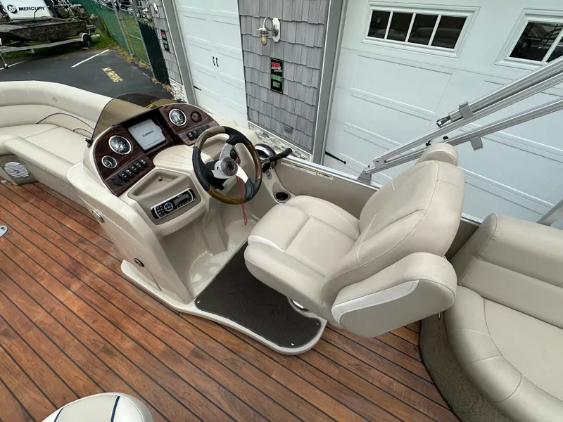 Slide: The Image of 2014 Avalon 2585 Catalina Bar / ENT Tri Toon High Performance boat interior with captain's chair and dashboard. - 12