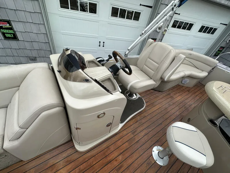 Slide: The Image of 2014 Avalon 2585 Catalina Bar / ENT Tri Toon High Performance boat interior with helm and seating. - 16