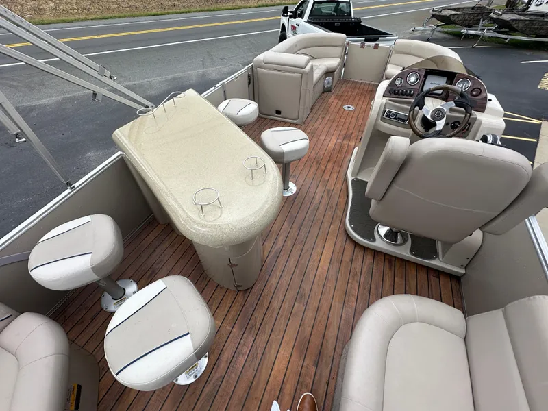 Slide: The Image of 2014 Avalon 2585 Catalina Bar / ENT Tri Toon High Performance boat interior with seating and bar area. - 20