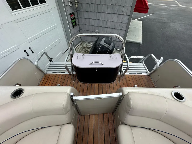 Slide: The Image of 2014 Avalon 2585 Catalina Bar / ENT Tri Toon High Performance boat interior with seating and cooler. - 21