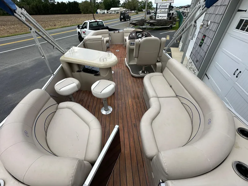 Slide: The Image of 2014 Avalon 2585 Catalina Bar / ENT Tri Toon High Performance boat interior with seating and bar stools. - 22