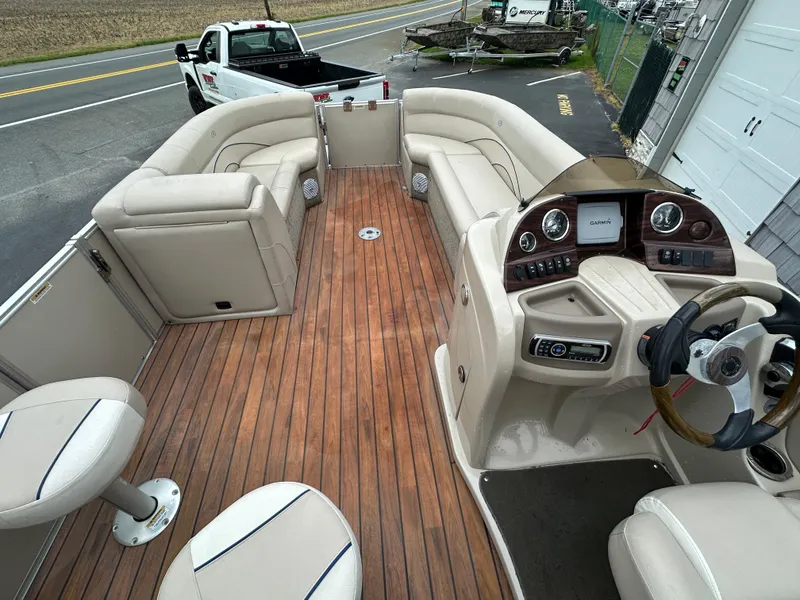 Slide: The Image of 2014 Avalon 2585 Catalina Bar / ENT Tri Toon High Performance boat with spacious seating and wood flooring. - 24