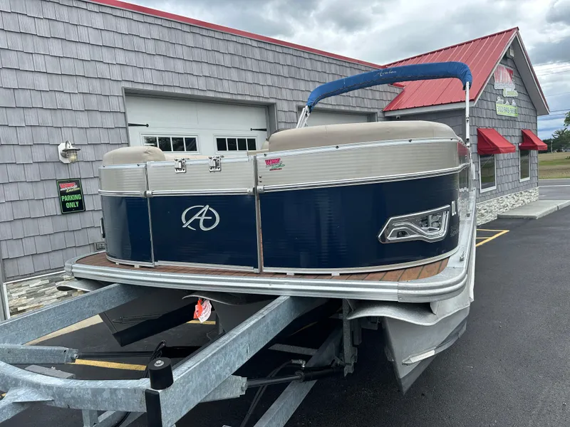 Slide: The Image of 2014 Avalon 2585 Catalina Bar / ENT Tri Toon High Performance pontoon boat on trailer. - 4