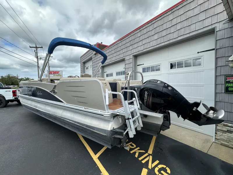 Slide: The Image of 2014 Avalon 2585 Catalina Bar / ENT Tri Toon High Performance boat parked outside. - 5