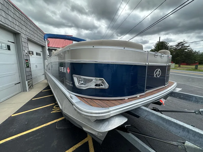 Slide: The Image of 2014 Avalon 2585 Catalina Bar / ENT Tri Toon High Performance boat on trailer. - 7