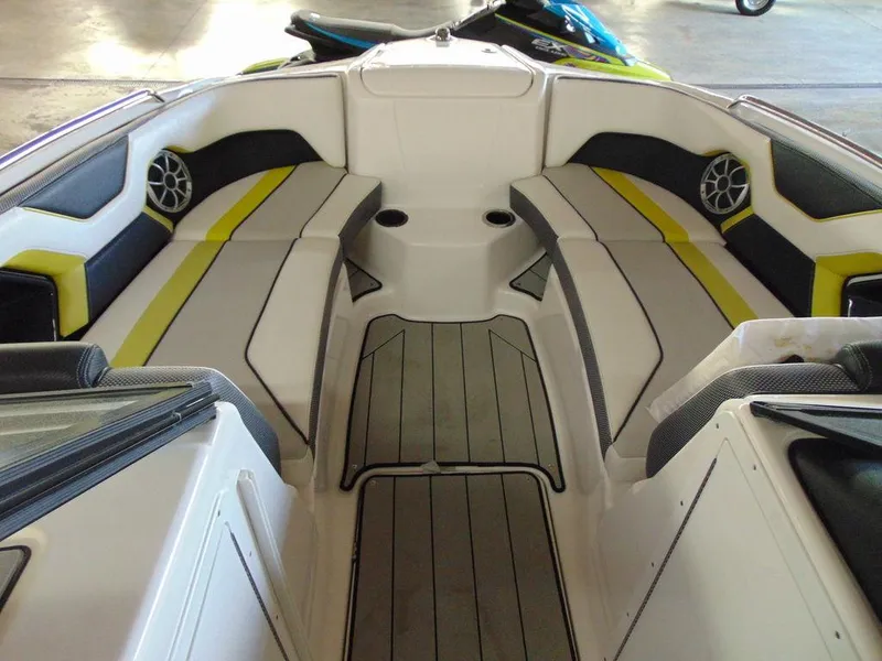 Slide: The Image of 2020 Yamaha Boats 212X interior seating and deck area. - 11