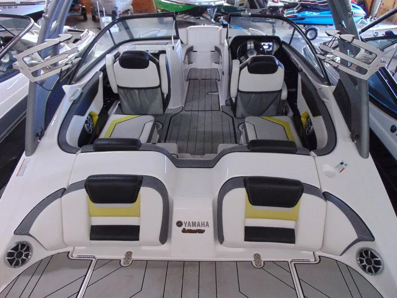 Slide: The Image of 2020 Yamaha Boats 212X interior, spacious seating, modern design, and advanced dashboard. - 4