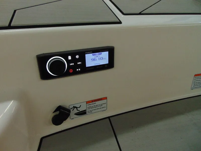 Slide: The Image of Yamaha Boats 2020 212X audio control panel and safety warning labels. - 5