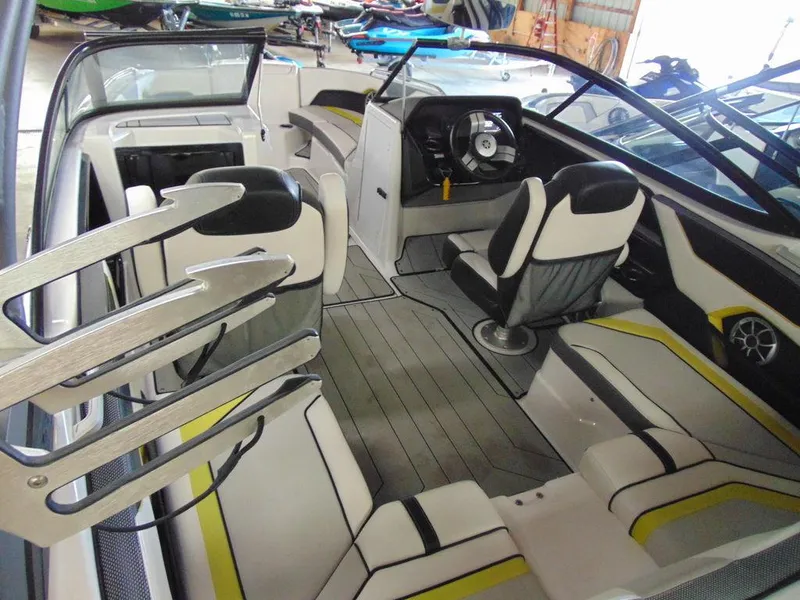 Slide: The Image of 2020 Yamaha Boats 212X interior with seating and steering wheel. - 6