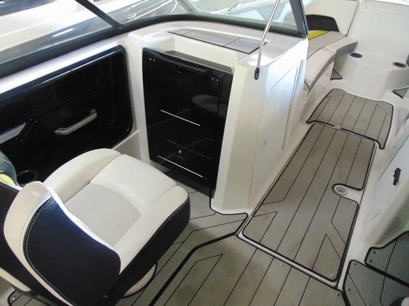 Slide: The Image of Interior of a 2020 Yamaha Boats 212X, featuring seating and storage compartments. - 9
