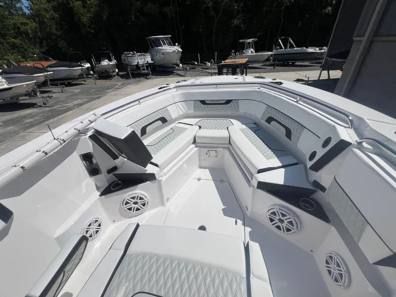 Slide: The Image of 2024 Blackfin 272 CC boat interior with seating and speakers. - 10