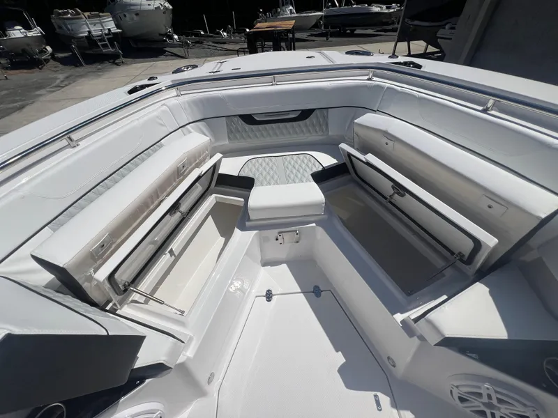 Slide: The Image of 2024 Blackfin 272 CC boat interior with open storage compartments. - 11