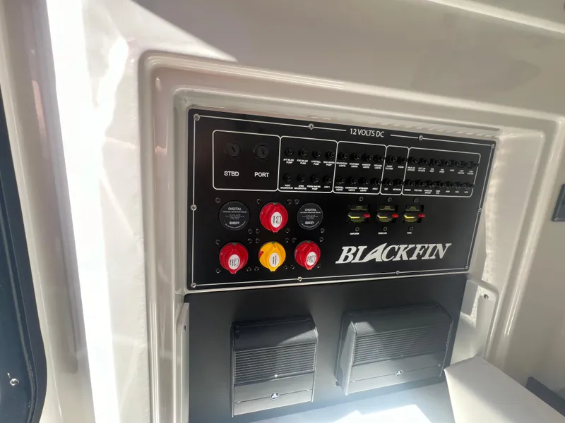 Slide: The Image of 2024 Blackfin 272 CC control panel with switches and circuit breakers. - 18