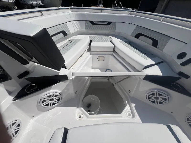Slide: The Image of 2024 Blackfin 272 CC boat interior with seating and storage compartments. - 19