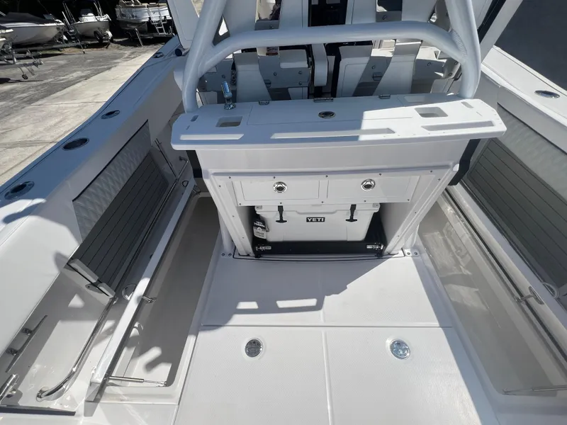 Slide: The Image of 2024 Blackfin 272 CC center console boat interior with storage compartments and seating. - 22