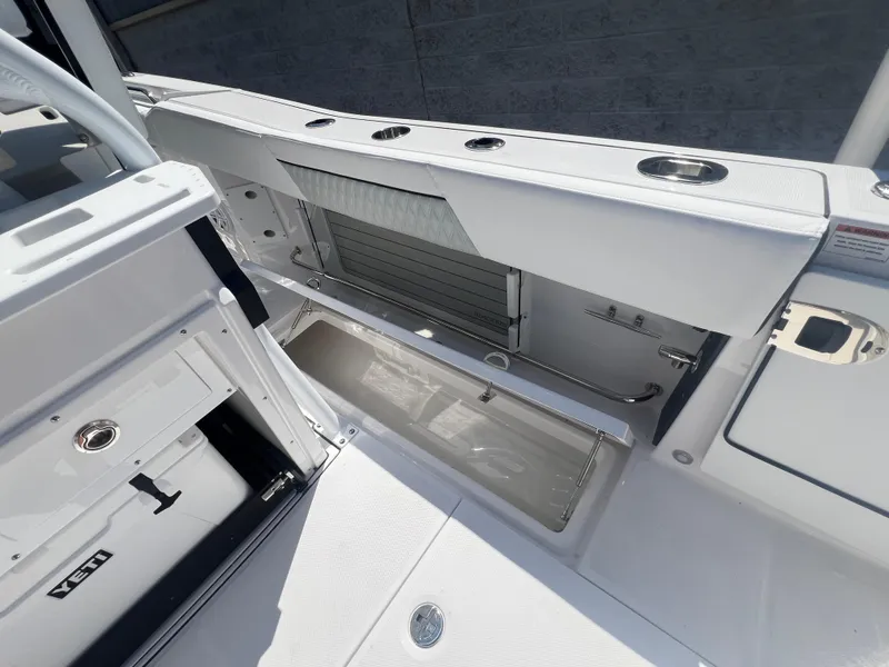 Slide: The Image of 2024 Blackfin 272 CC boat interior with storage compartments. - 24