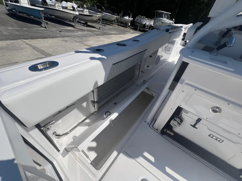 Slide: The Image of 2024 Blackfin 272 CC boat interior with open storage compartments. - 25
