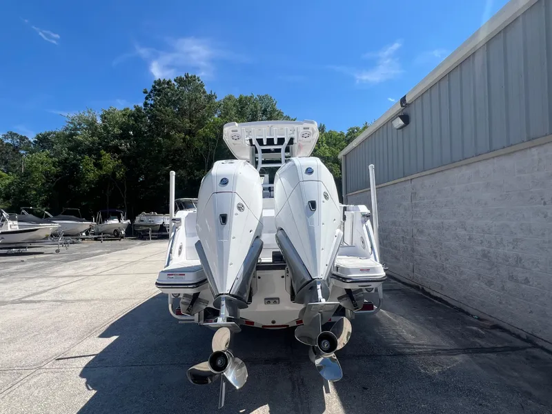 Slide: The Image of 2024 Blackfin 272 CC boat with twin outboard engines, rear view. - 3