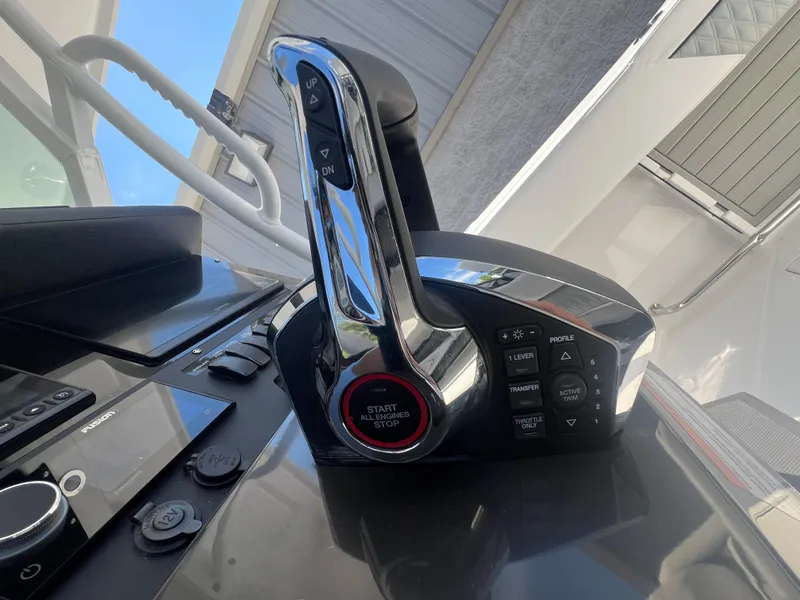 Slide: The Image of 2024 Blackfin 272 CC boat throttle control and dashboard. - 36