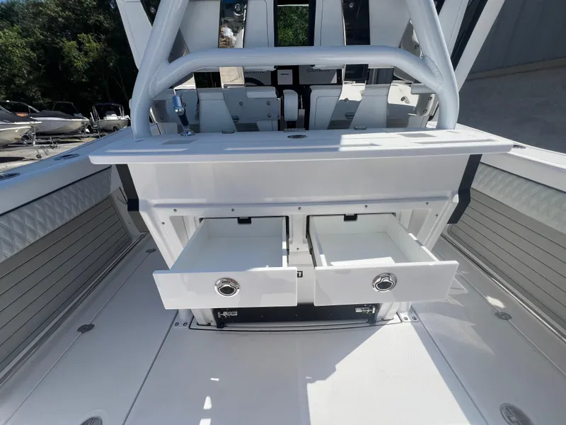 Slide: The Image of 2024 Blackfin 272 CC center console boat with open storage drawers. - 8
