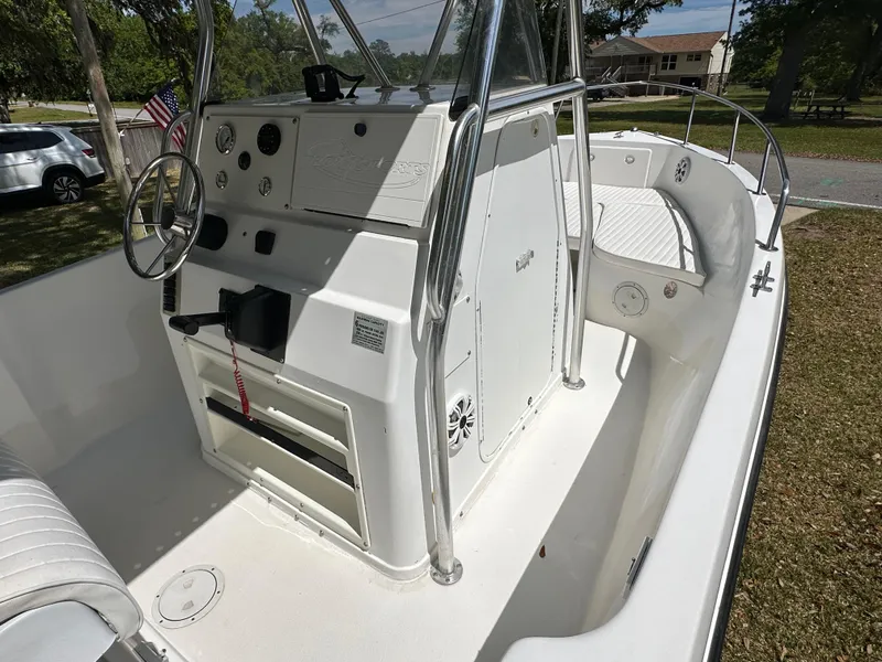 Slide: The Image of 2001 Pro Sports 2200 CC Blue Water boat interior with steering console and seating. - 14