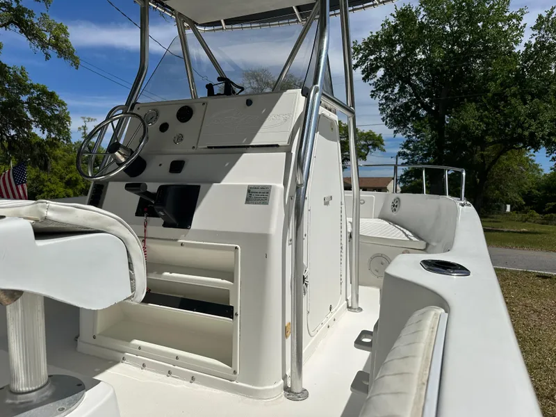 Slide: The Image of 2001 Pro Sports 2200 CC Blue Water boat interior with steering console and seating. - 20