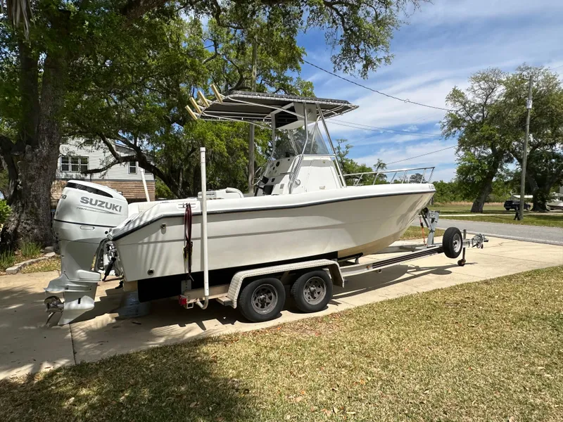 Slide: The Image of 2001 Pro Sports 2200 CC Blue Water boat on trailer with Suzuki outboard motor. - 4