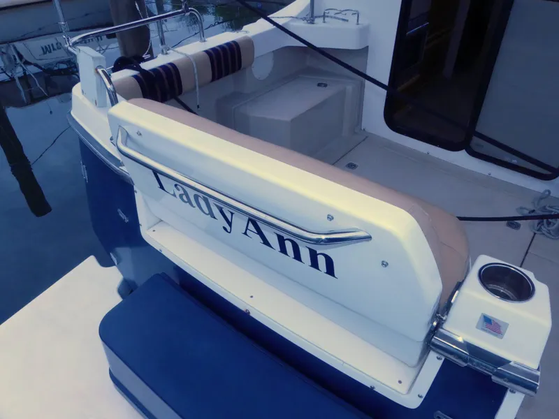 Slide: The Image of 2014 Cutwater C 26 boat named Lady Ann docked. - 12