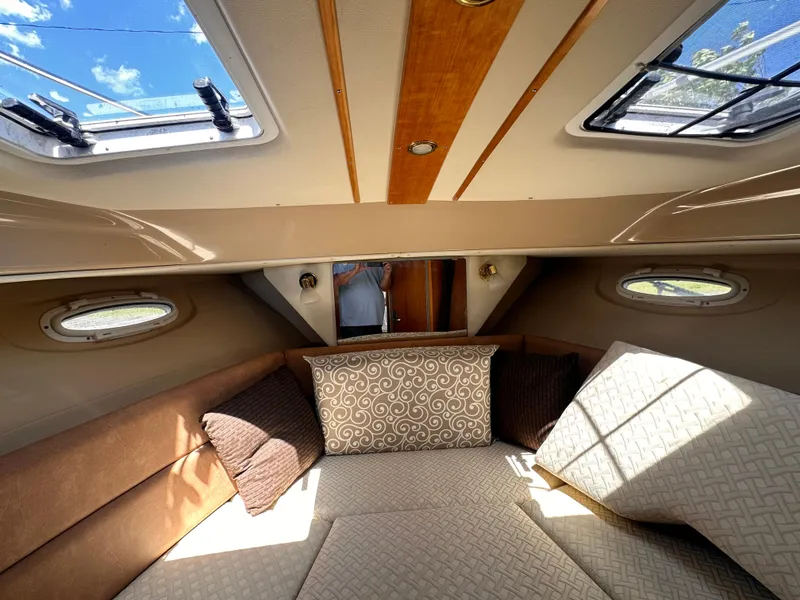 Slide: The Image of Interior cabin of a 2014 Cutwater C 26 boat with skylights and cushions. - 25